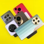 A collection of diverse smartphone designs on a vibrant yellow backdrop.